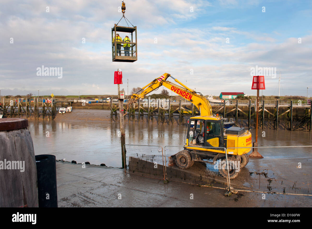 Works on the wharf infrastructure and the River Rother Tidal Walls sea flood defences, Rye Harbour, Sussex. Stock Photo
