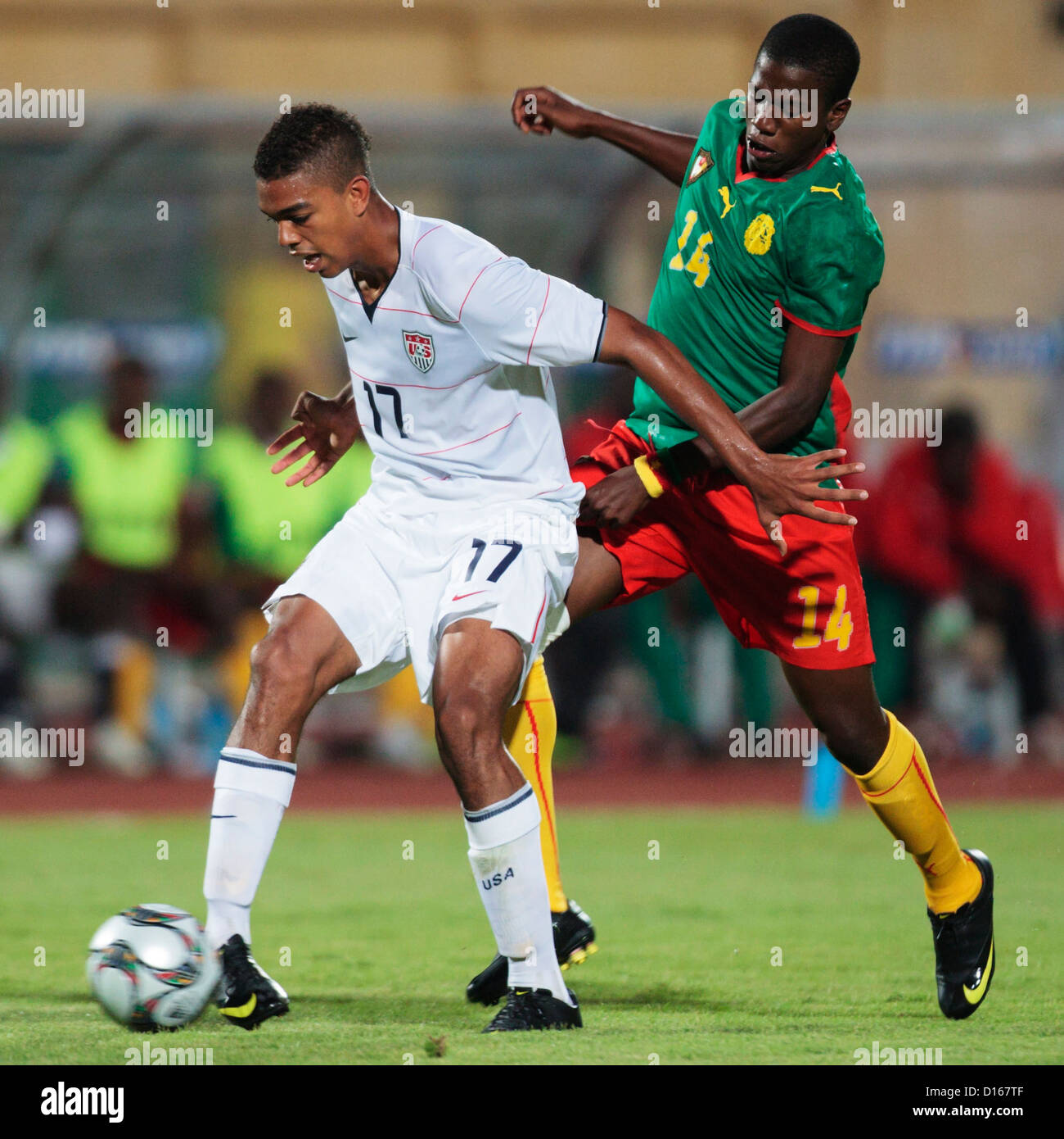 Patrick Ekeng of Cameroon (R) pressures Bryan Arguez of the United States (L) during the 2009 FIFA U-20 World Cup Group C match. Stock Photo