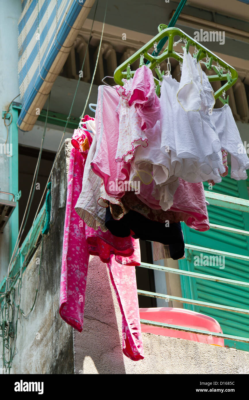 Laundry hung out to dry on an exterior Facade in Ho Chi Minh City