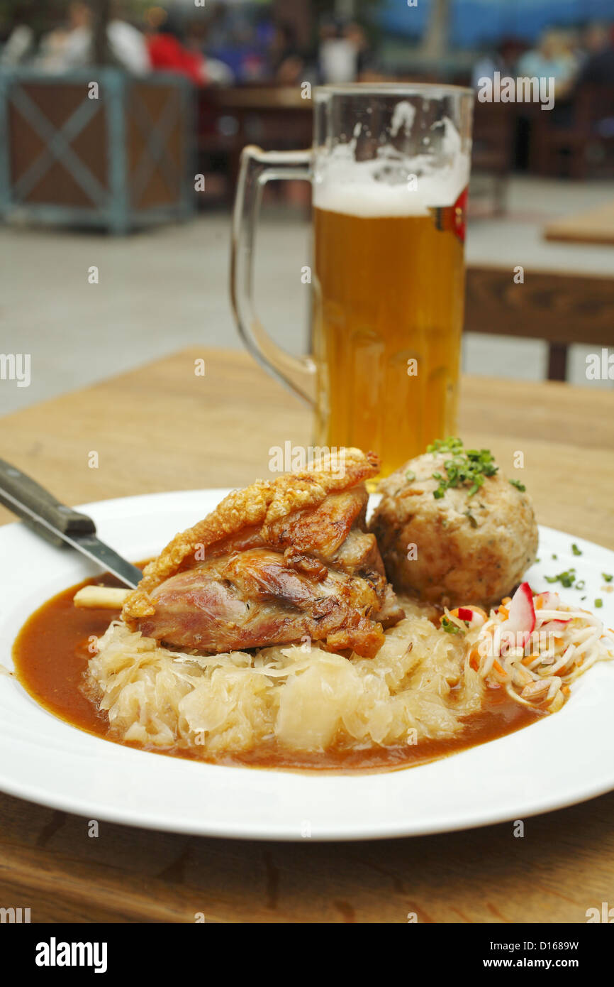 Braised Pork Knuckle dinner with beer, served at Airbräu Bavarian