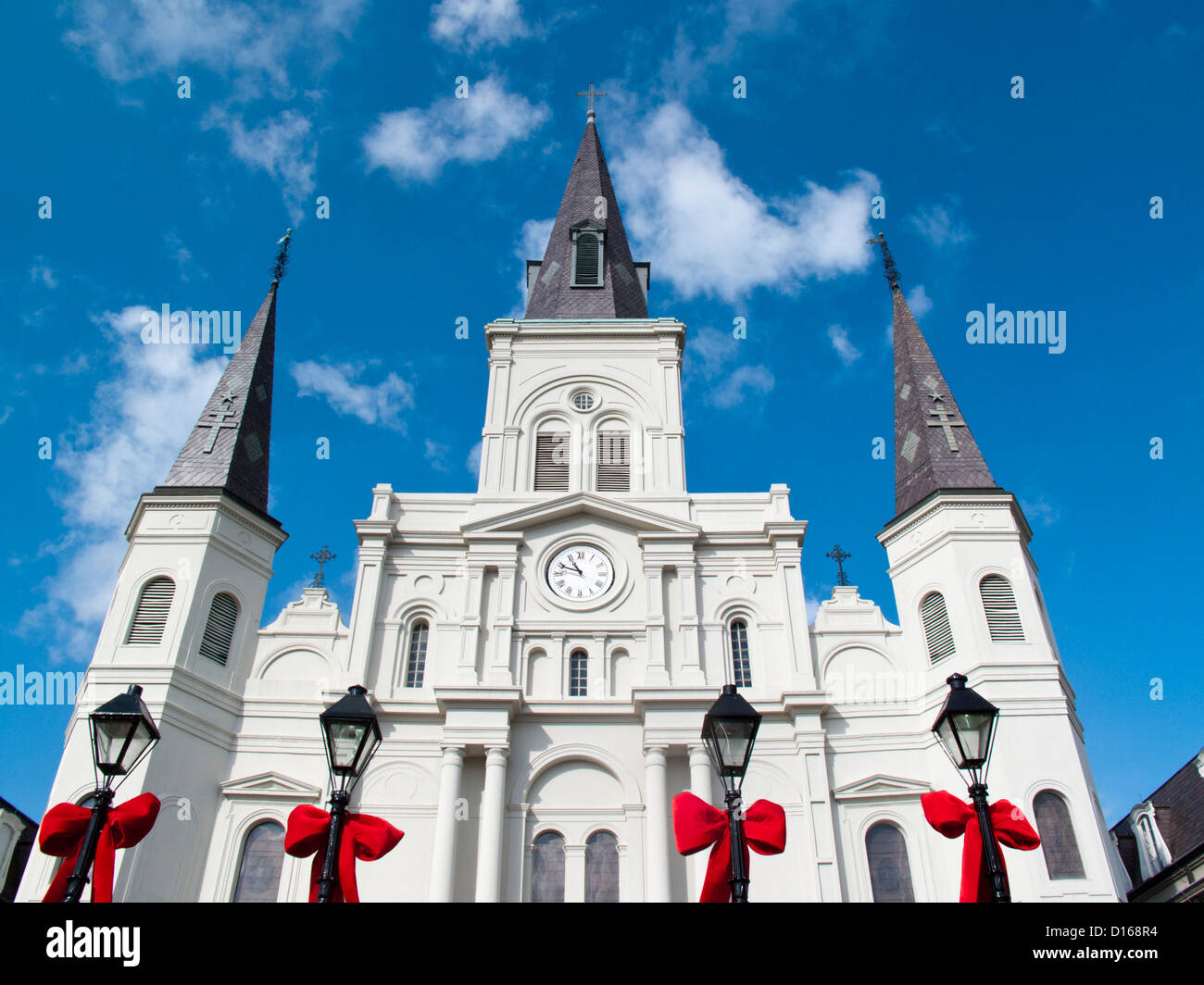 Christmas bows on lamps in Jackson Square, Saint Louis Cathedral; New Orleans, Louisiana, United States Stock Photo