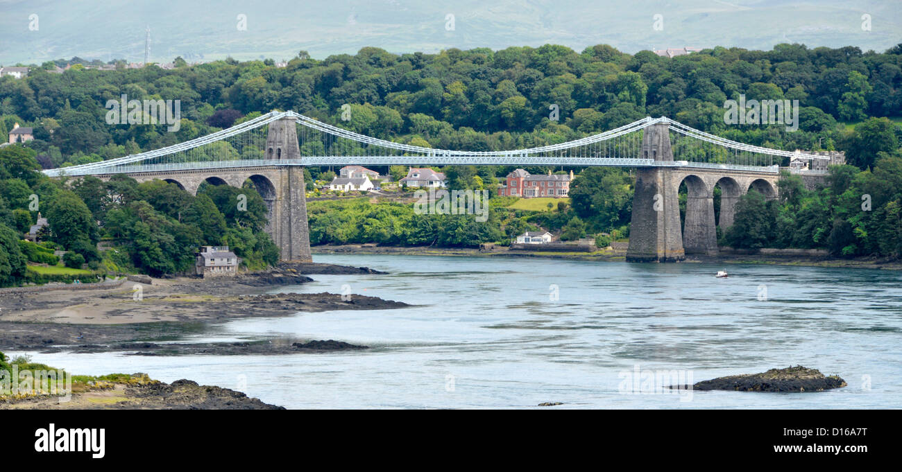 Menai Bridge designed by Thomas Telford crossing the Menai Straits waterway by road connecting island of Anglesey with the North Wales UK mainland Stock Photo