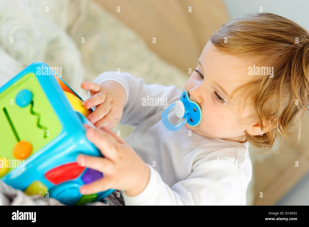 Cute little boy playing with toy at home Stock Photo - Alamy