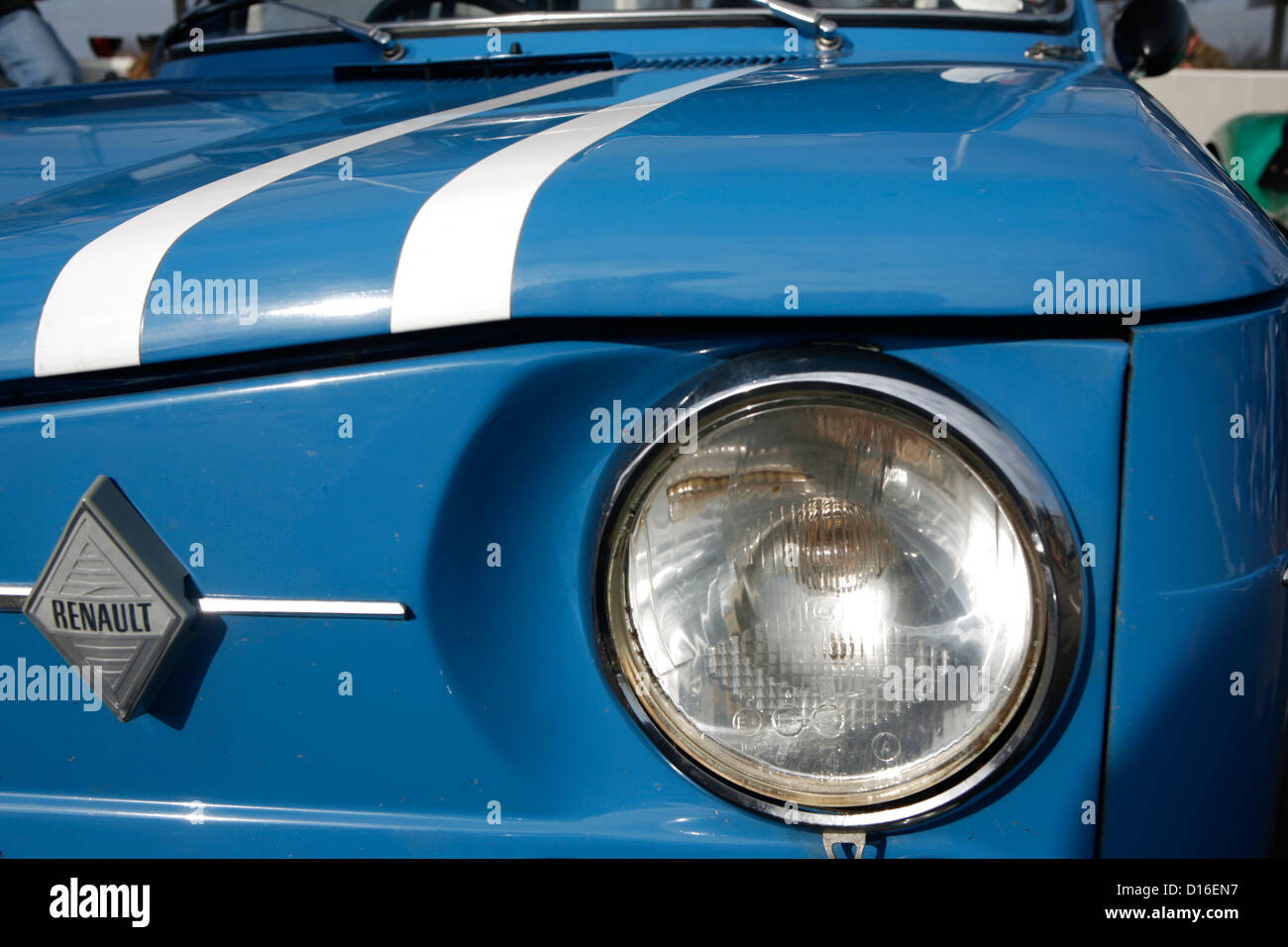 The front badge and headlight of an old Renault car. Stock Photo