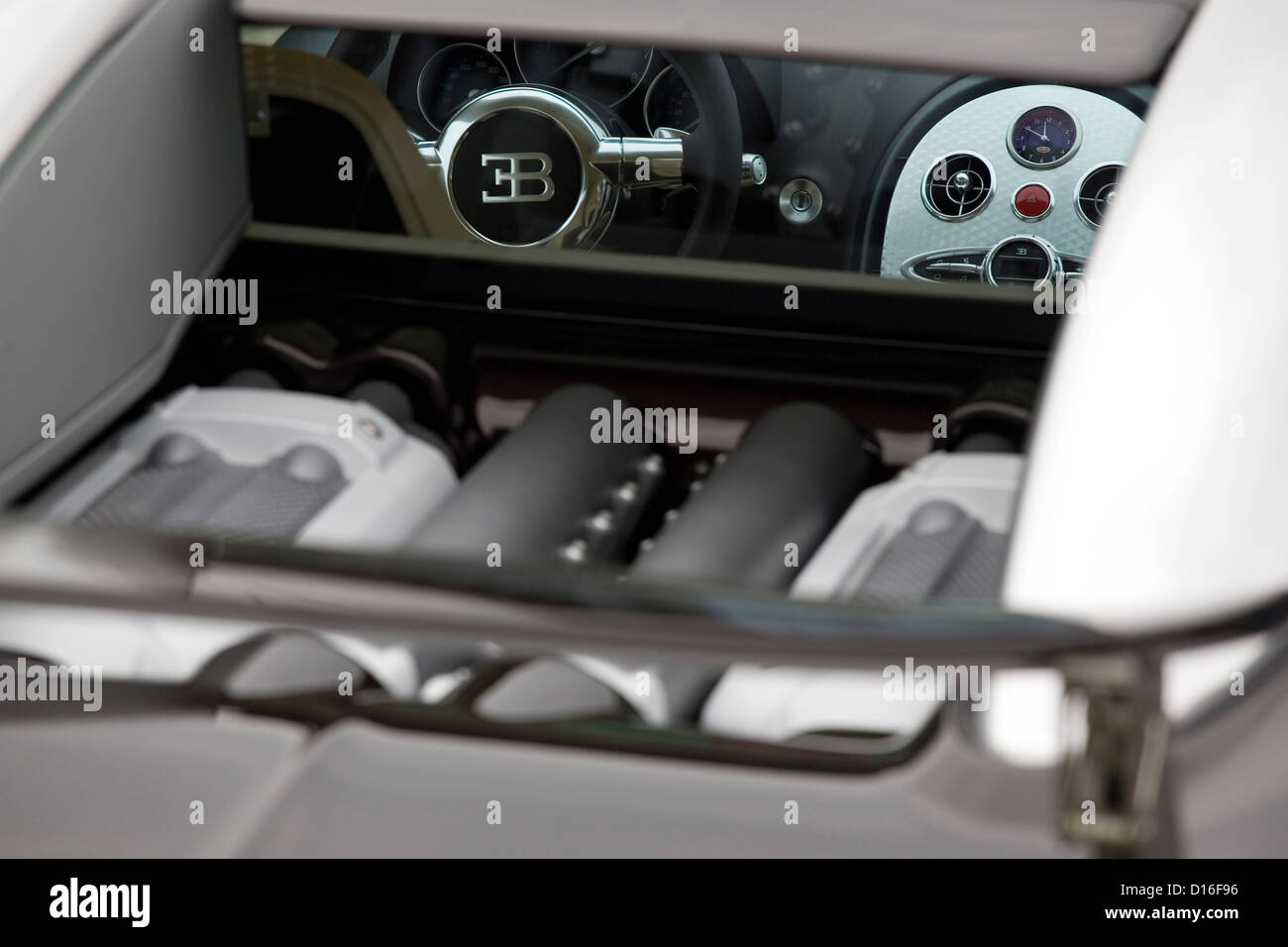 A view of the rear and interior of a Bugatti Veyron parked at a classic car show. Stock Photo