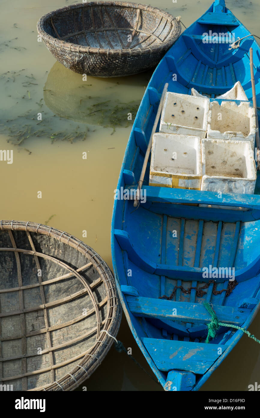 Blue wooden fishing boat with floating fishing baskets moored at Hoi An in  Vietnam South East Asia Stock Photo - Alamy