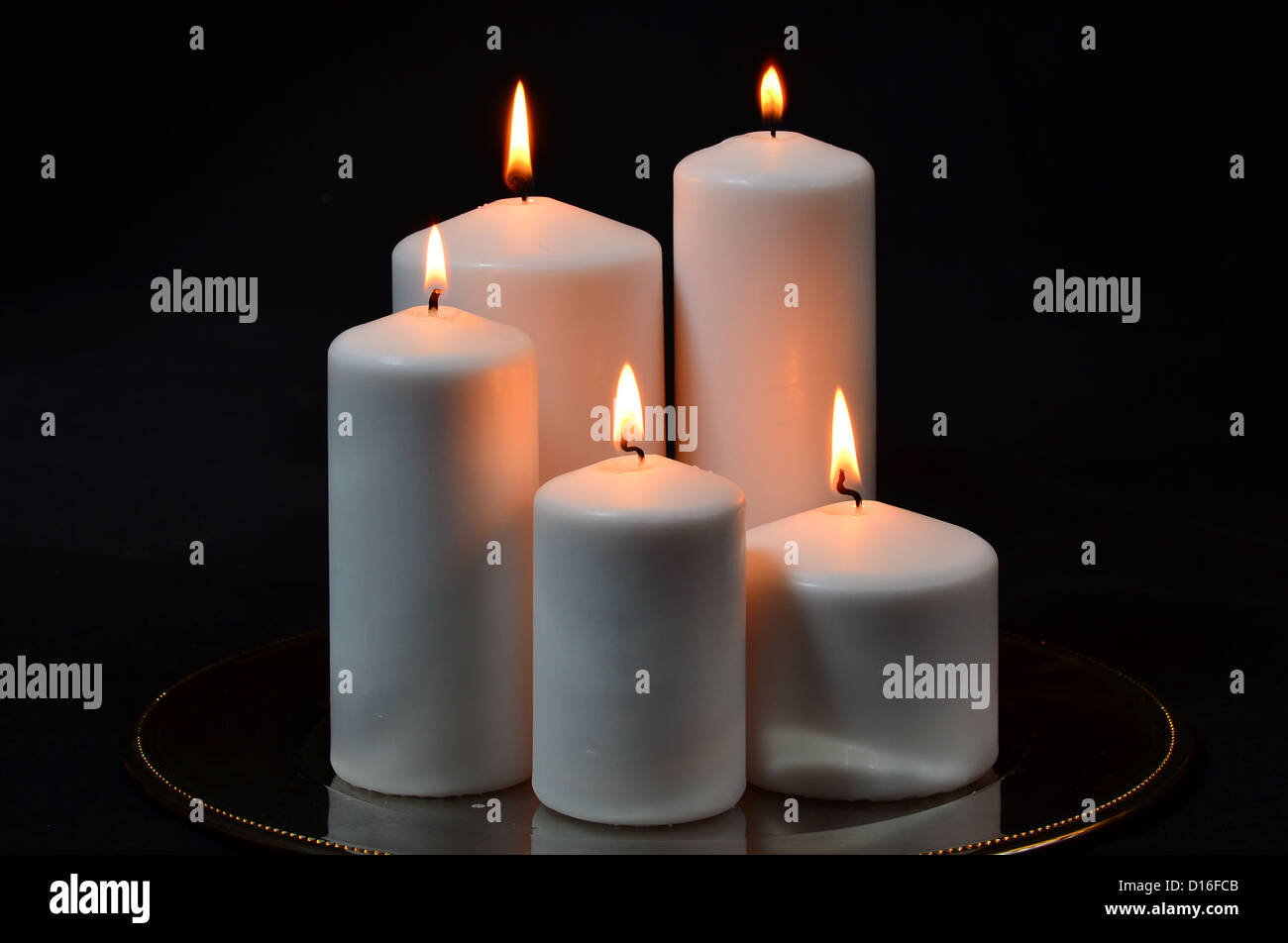 Big white candles on black background Stock Photo Alamy
