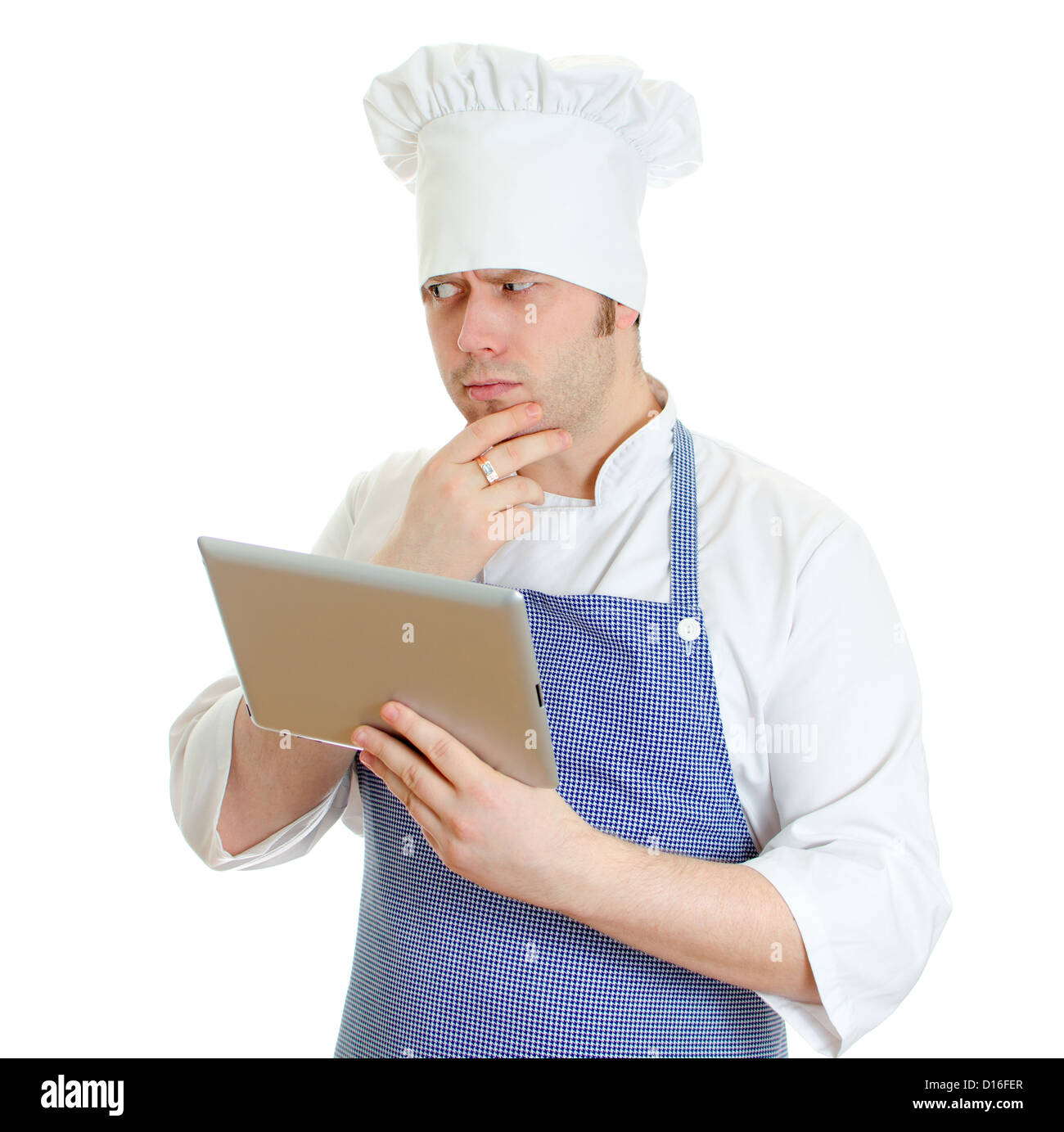Handsome chef cook using tablet pc. Isolated on white Stock Photo