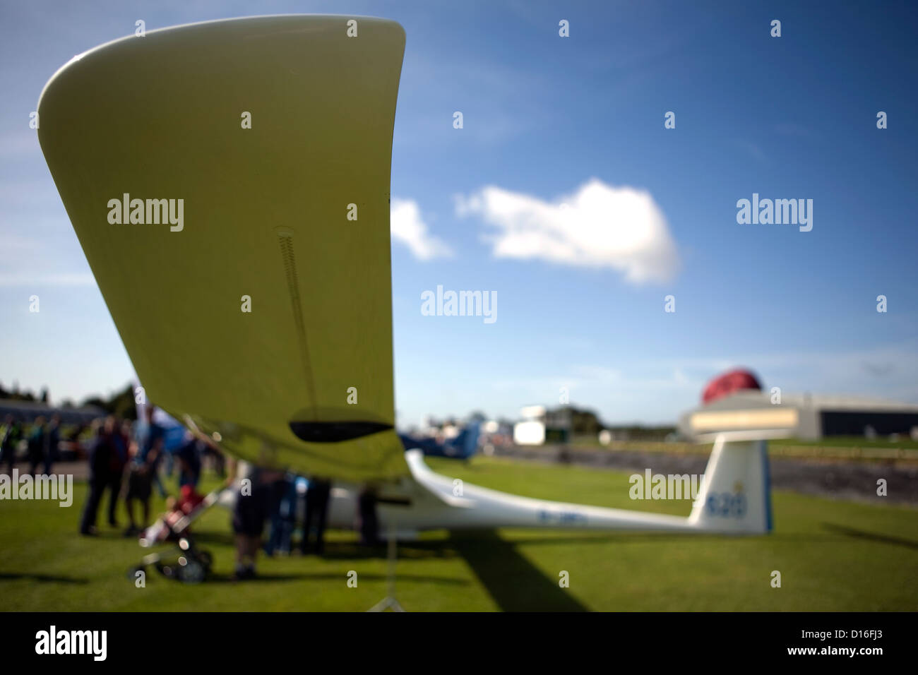 The wingtip of a glider sitting on the ground. Stock Photo