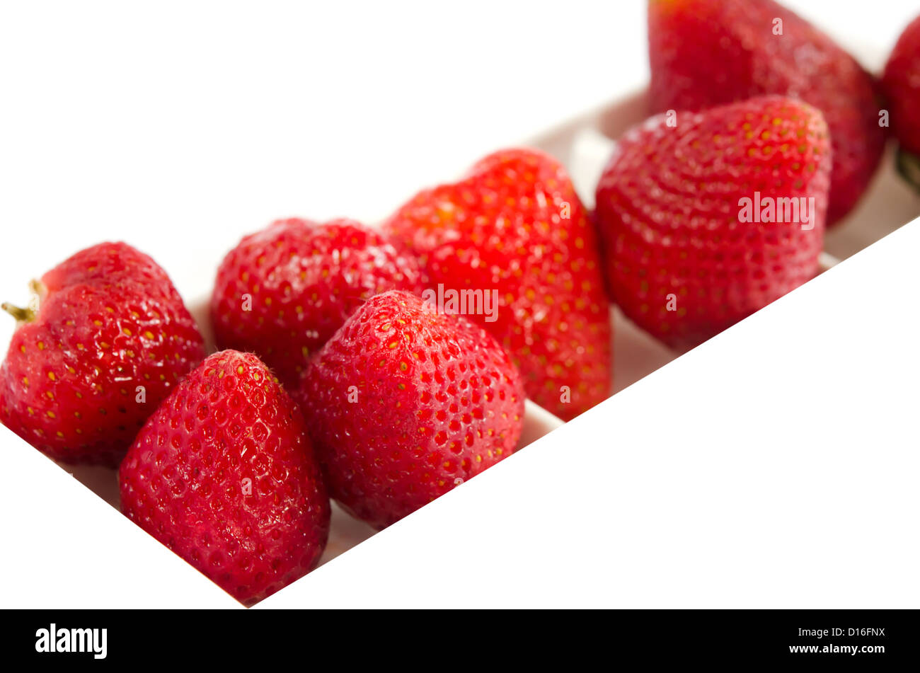 berry fruits in white bowl , Strawberries Stock Photo