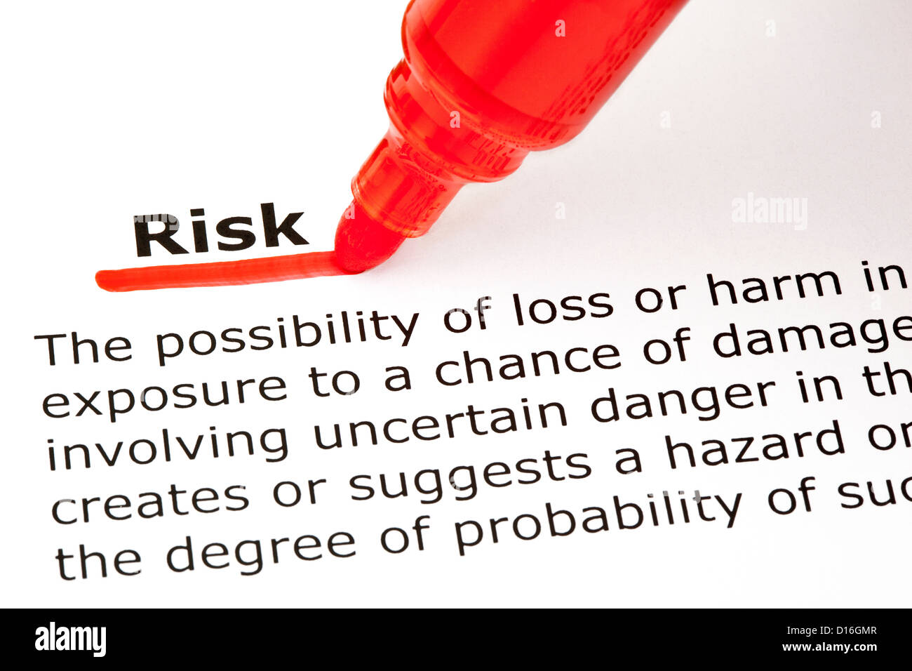Definition of the word Risk, underlined with red marker Stock Photo