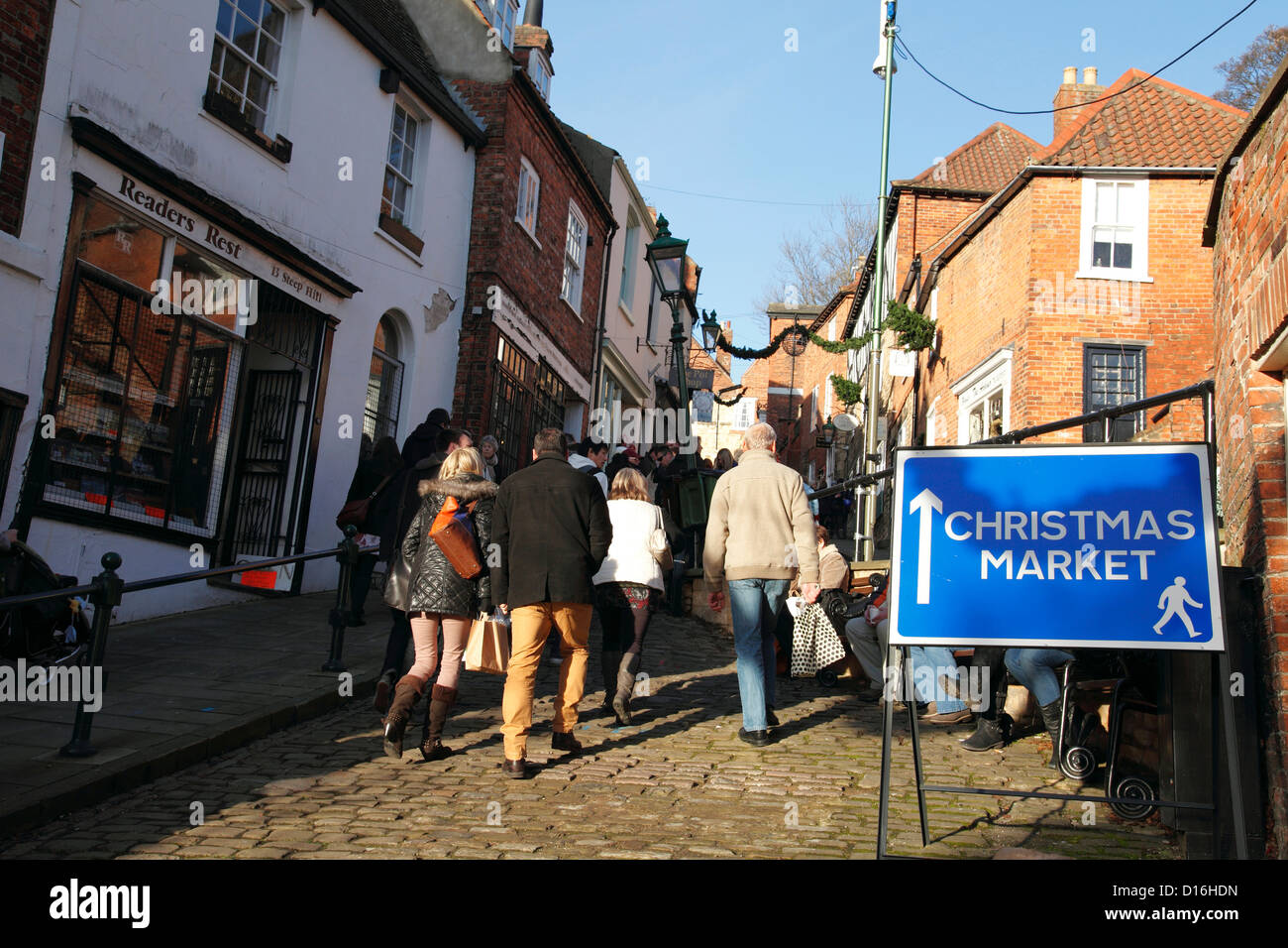 Visitors walking to the Lincoln Christmas Market, Steep Hill, Lincoln, England, U.K. Stock Photo