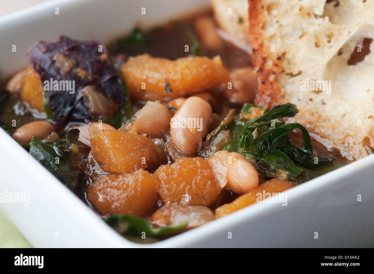 Fresh white navy bean soup with garden vegetables Stock Photo