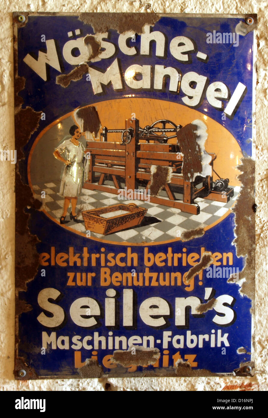 Museum of Industry and Railway in Lower Silesia.Enamel advert: Wäsche-Mangel, elektrisch betrieben zur Benutzung! Seiler's Machi Stock Photo