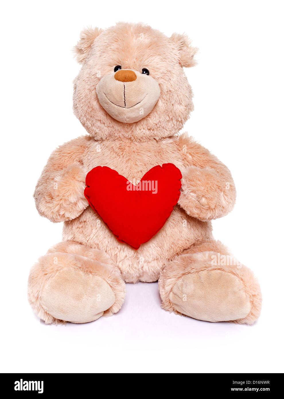 Brown teddy bear sitting and holding red heart Stock Photo - Alamy