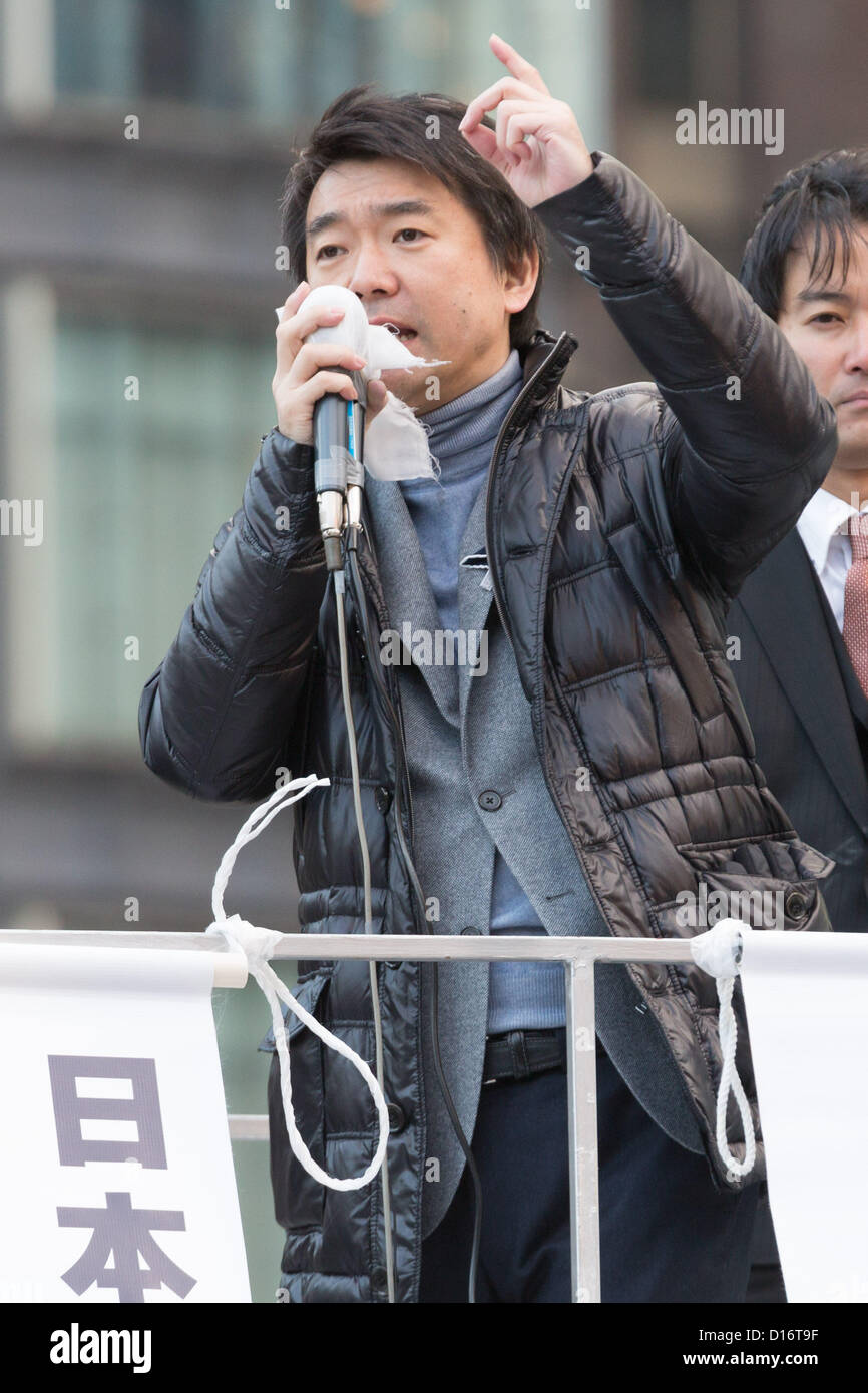 December 9, 2012, Tokyo, Japan - Osaka Mayor Toru Hashimoto, who has founded the Japan Restoration Party, addresses a crowd of voters during his stumping stop at the Tokyo railroad station on Sunday, December 9, 2012, in his campaign for the December 16 general election. A recent poll showed Hashimoto's JRP followed close behind the most favored Liberal Democratic Party led by former Prime Minister Shinzo Abe. (Photo by AFLO) Stock Photo