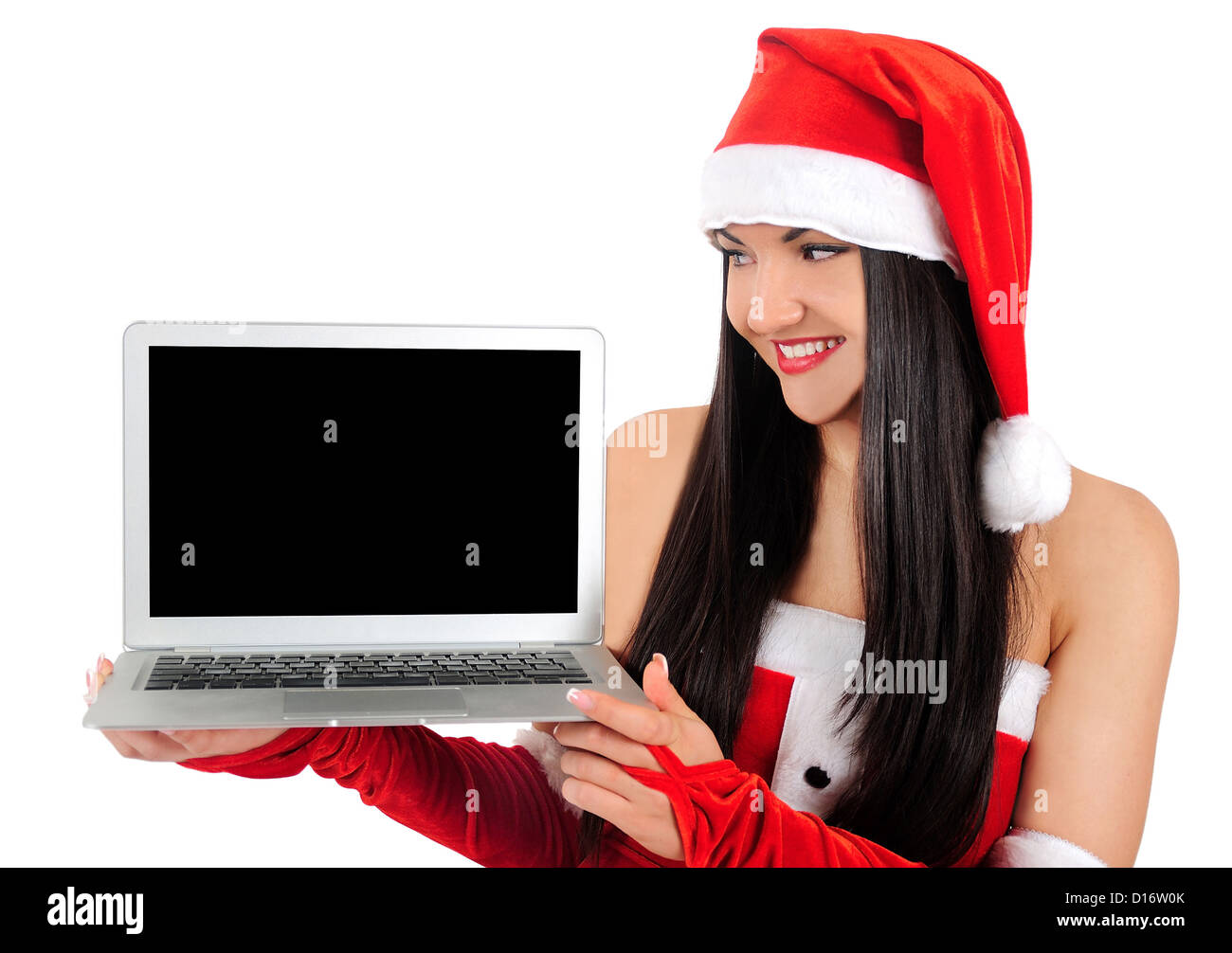 Isolated young christmas girl holding laptop Stock Photo - Alamy