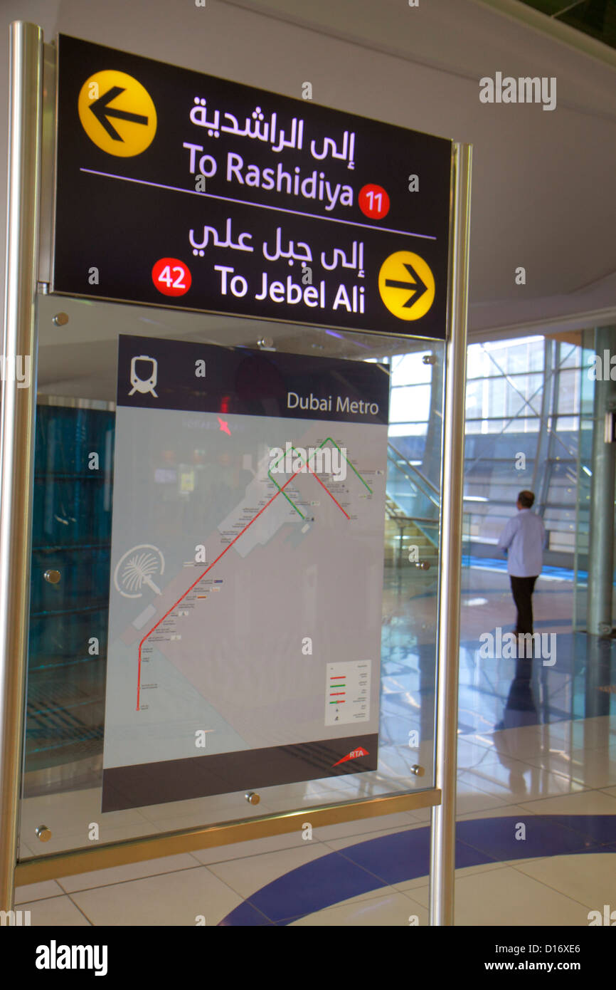 Dubai UAE,United Arab Emirates,Garhoud,Dubai Metro,subway,train,train,Emirates Station,Red Line,sign,arrows,directions,map,English,Arabic,language,bil Stock Photo
