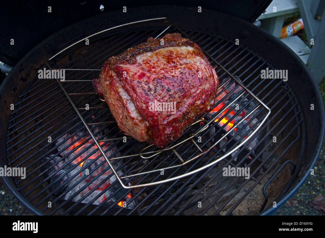 Prime Rib Roast onCharcoal Barbecue Stock Photo