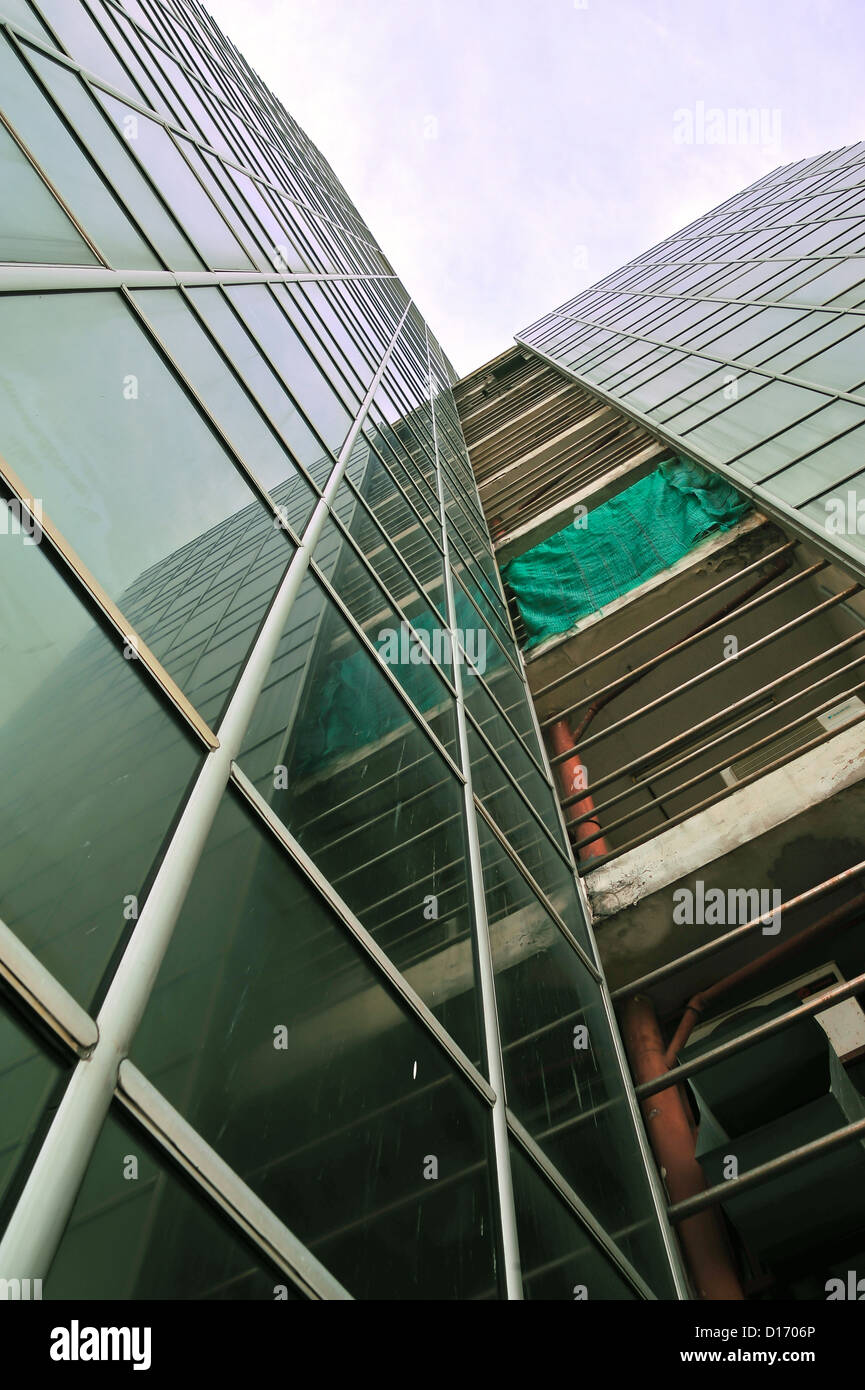 underside angle view to textured background of modern glass building skyscrapers Stock Photo