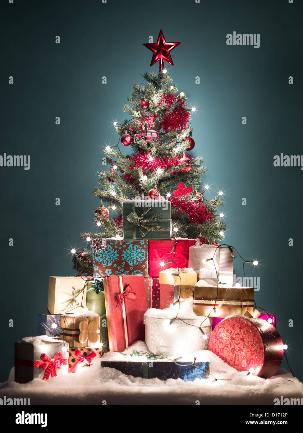 green christmas tree with beatiful red decorations surrounded by a heap of gift boxes covered with - Green Christmas Tree With Blue Decorations green christmas tree with beatiful red decorations surrounded by a heap of gift boxes covered with - Green Christmas Tree With Blue Decorations
