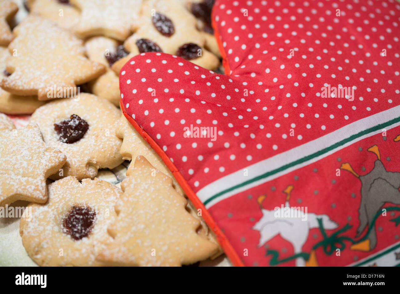Christmas cookies with oven mitt Stock Photo
