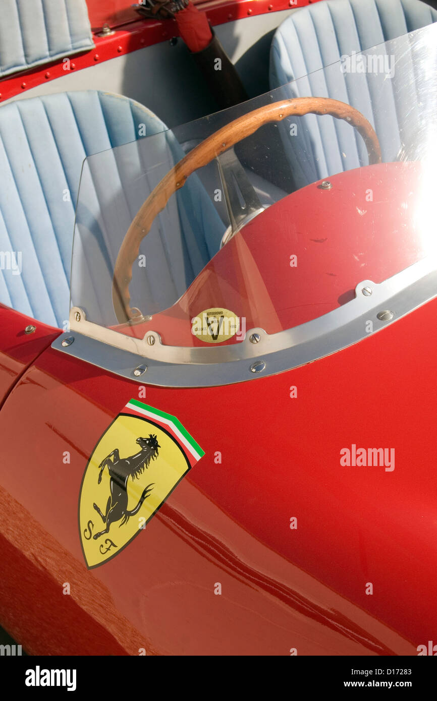 a ferrari badge on the front of a red classic ferrari D17283