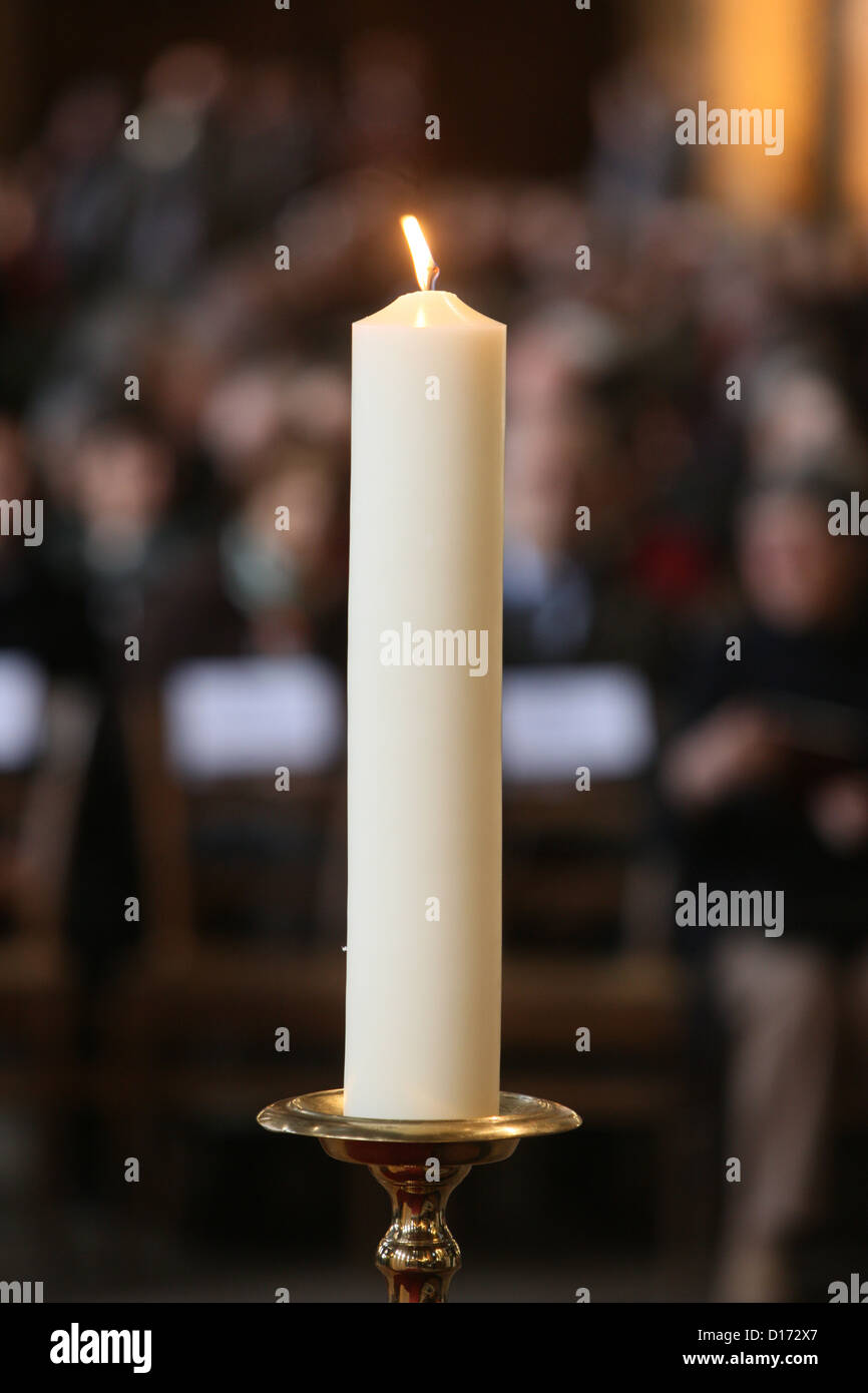 Mass in Saint-Eustache church. Candle Stock Photo