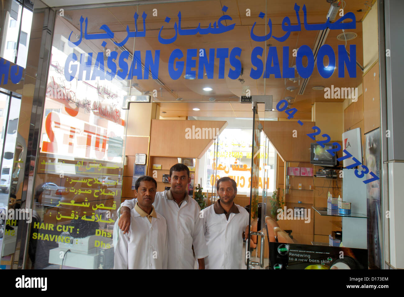 Dubai UAE,United Arab Emirates,Deira,Al Rigga,Ghassan Gents Saloon,barber,hair stylist,migrant worker,workers,foreign laborer,labor,labour,resident,re Stock Photo
