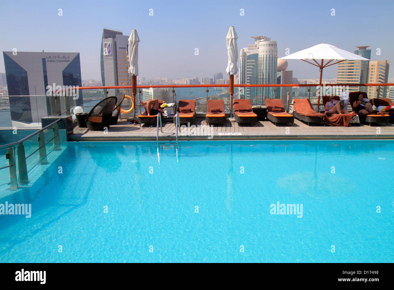 Dubai UAE,United Arab Emirates,Baniyas Road,Hilton Dubai Creek,hotel,rooftop swimming pool,water,lounge chairs,UAE121011041 Stock Photo