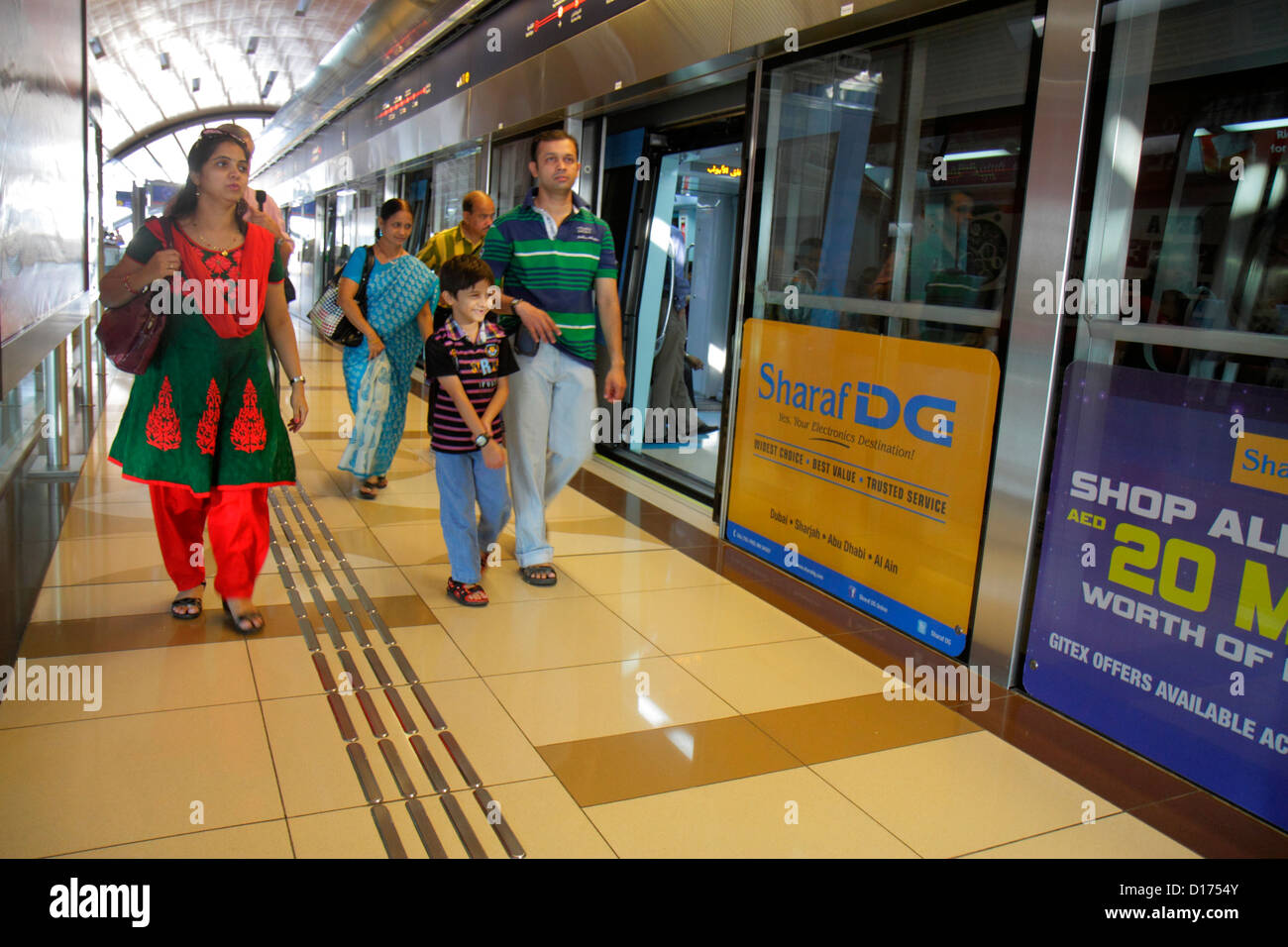 Dubai UAE,United Arab Emirates,Deira,Al Rigga Metro Station,Red Line,subway,train,train,platform,Asian man men male adult adults,father,parent,parents Stock Photo