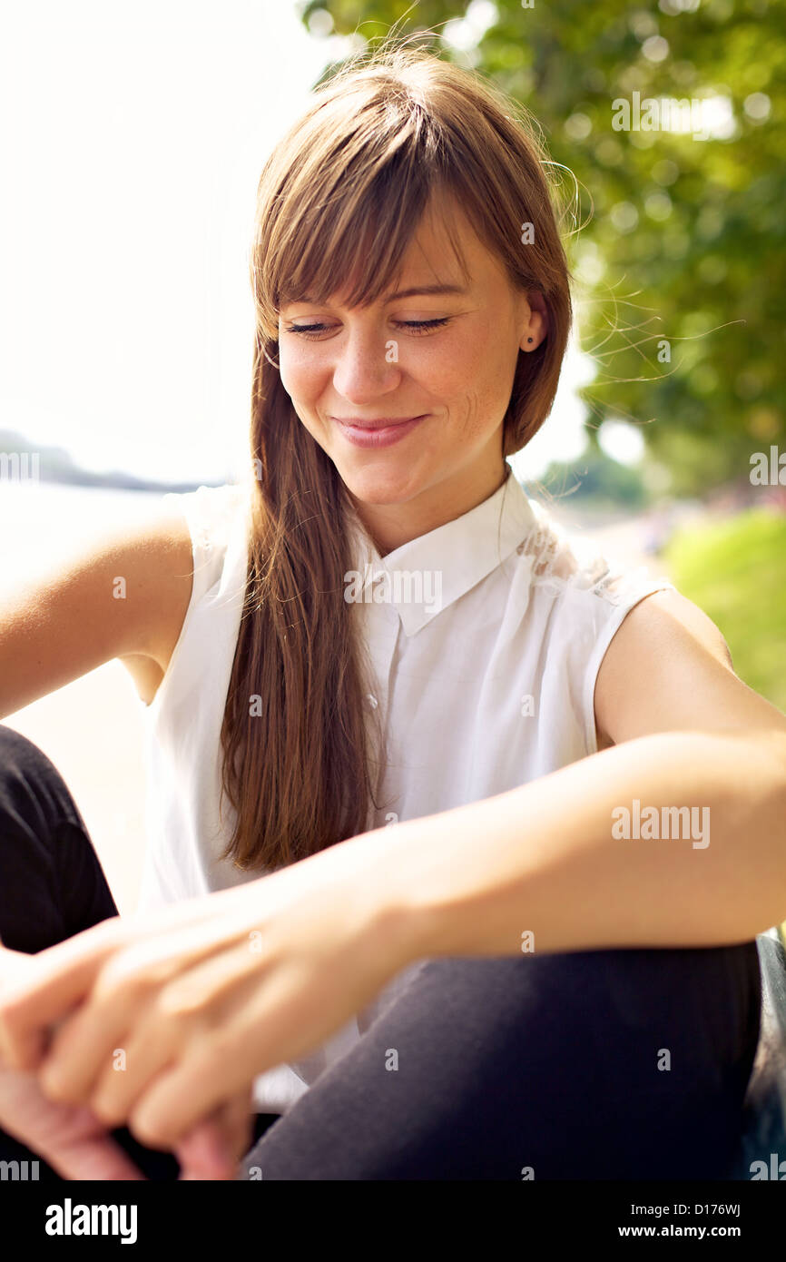 Closeup of a pretty girl enjoying the sunny summer Stock Photo