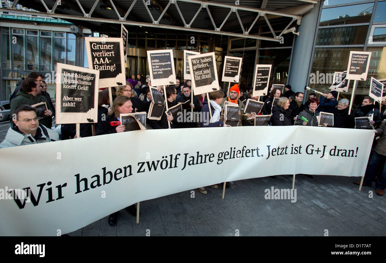 Employees of publishing house Gruner + Jahr Business Media demonstrate in front of their employer's headquarters in Hamburg, Germany, 07 December 2012. The final issue of the daily business nespaper 'Financial Times Germany' (FTD) appeared on 07 December 2012. Photo: CHRISTIAN CHARISIUS Stock Photo