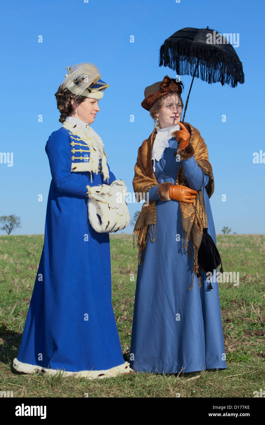 Two beautiful ladies in 19th-century attire in Jena, Germany Stock Photo