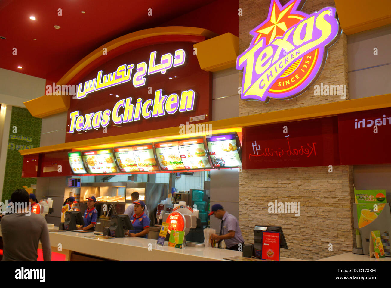 Dubai UAE,United Arab Emirates,Downtown Dubai,Dubai mall,food court plaza,Texas Chicken,fast food,restaurant restaurants food dining cafe cafes,Englis Stock Photo