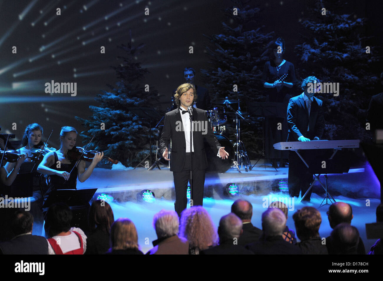 Swiss tenor Erkan Aki performs at the ZDF telethon 'Wonderful Christmas Songs' ('Die schoensten Weihnachts-Hits') to help the cause of relief agencies 'Misereor' and 'Brot fuer die Welt' in Munich, Germany, 06 December 2012. Both agencies support aid in Africa, Asia and Latin America. Photo: Ursula Dueren Stock Photo