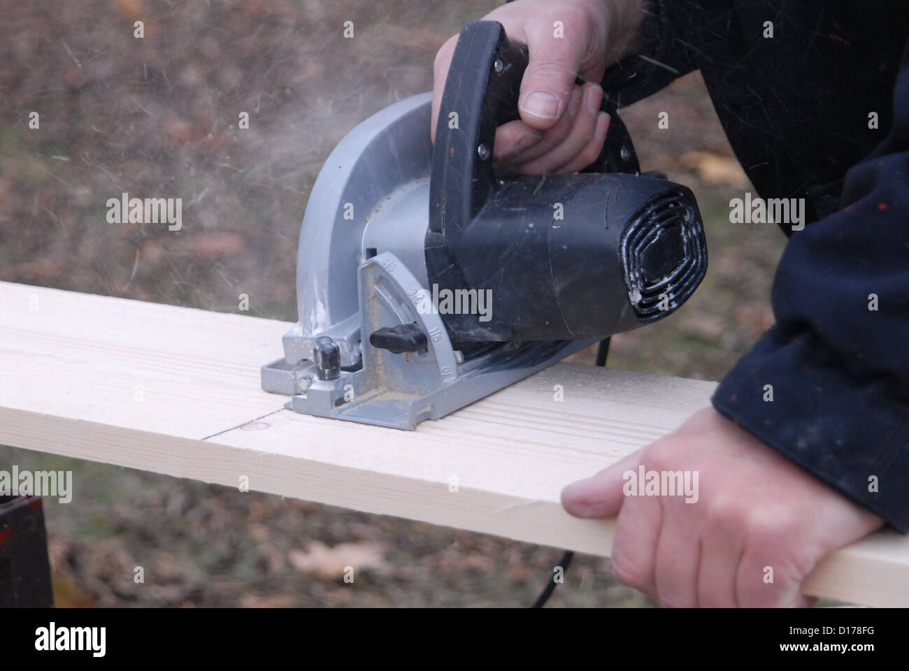 Man using circular saw. Stock Photo