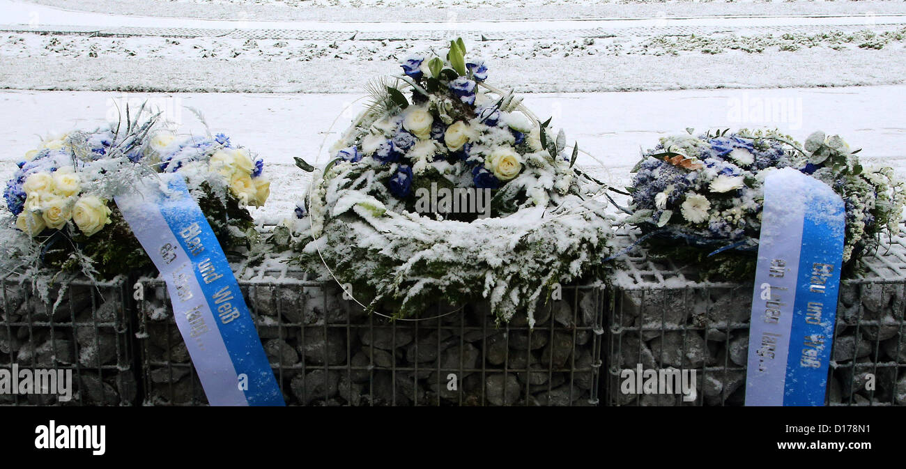 Blue and white wreaths have been laid down at the newly opened graveyard for Schalke 04 fans in Gelsenkirchen, Germany, 07 December 2012. In reference to the founding year, the stadium-shaped 'fan yard' consists of 1904 graves. Photo: ROLAND WEIHRAUCH Stock Photo