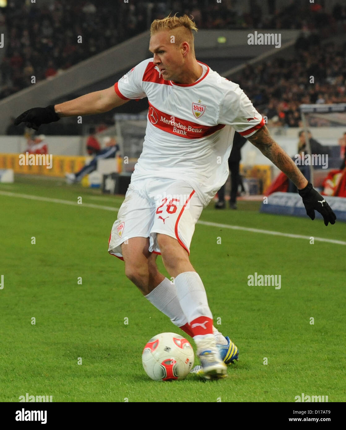 Stuttgart's Raphael Holzhauser plays ball during Bundesliga soccer match between VfB Stuttgart FC Schalke Mercedes Benz Arena in Stutgart Germany 08 December 2012 Photo: MARIJAN MURAT (ATTENTION: EMBARGO CONDITIONS! DFL permits further utilisation up 15 pictures only (no sequntial pictures or video-similar series pictures allowed) via internet online media during match (including halftime) taken inside stadium and/or prior start match DFL permits unrestricted transmission digitised recordings during match exclusively internal editorial processing only (e.g via picture picture databases) Stock Photo