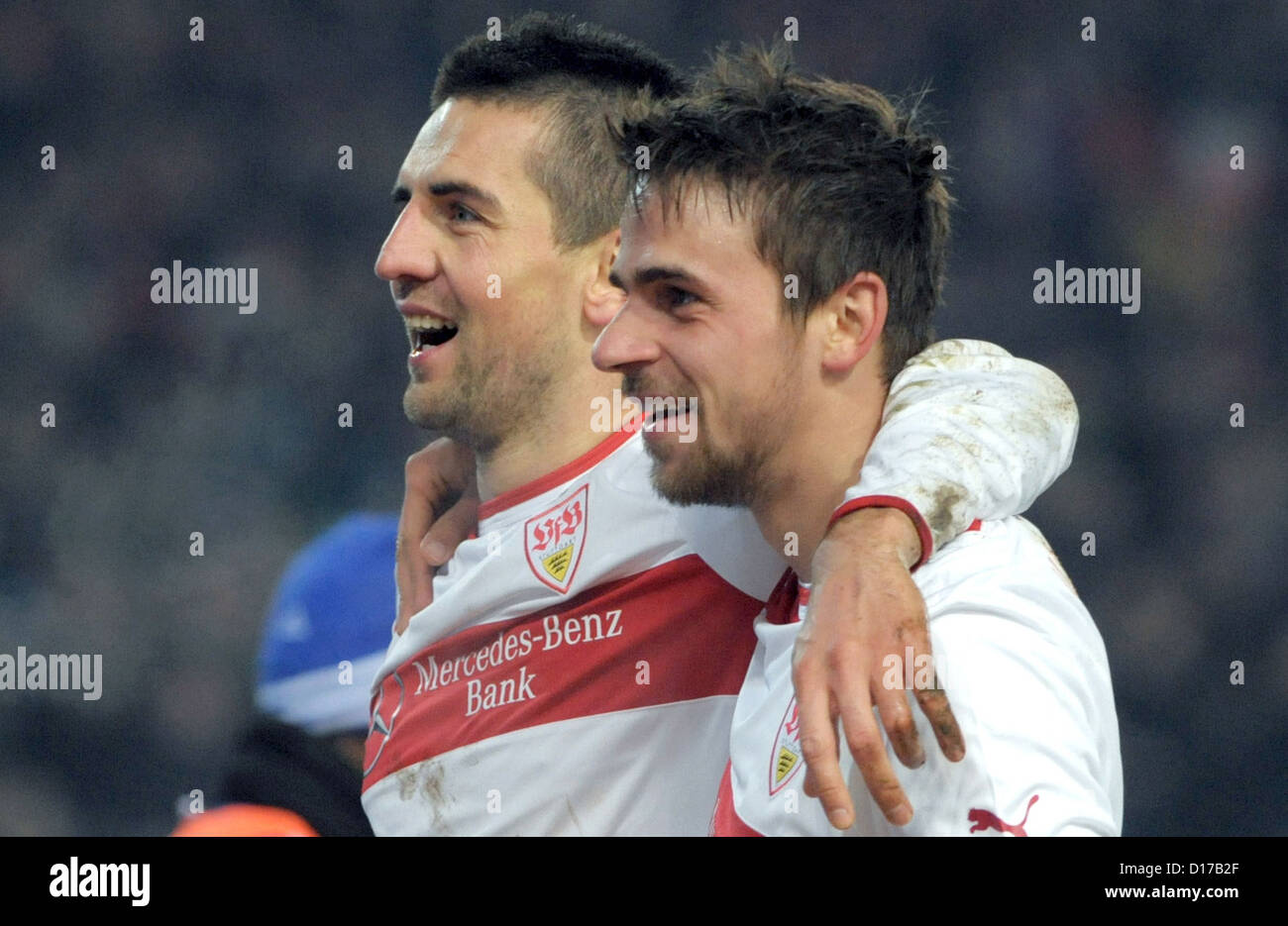 Stuttgart's Vedad Ibisevic (L) celebrates his 3-1 goal with teammate Martin Harnik during Bundesliga soccer match between VfB Stuttgart FC Schalke Mercedes Benz Arena in Stutgart Germany 08 December 2012 Photo: MARIJAN MURAT (ATTENTION: EMBARGO CONDITIONS! DFL permits further utilisation up 15 pictures only (no sequntial pictures or video-similar series pictures allowed) via internet online media during match (including halftime) taken inside stadium and/or prior start match DFL permits unrestricted transmission digitised recordings during match exclusively internal editorial processing only Stock Photo