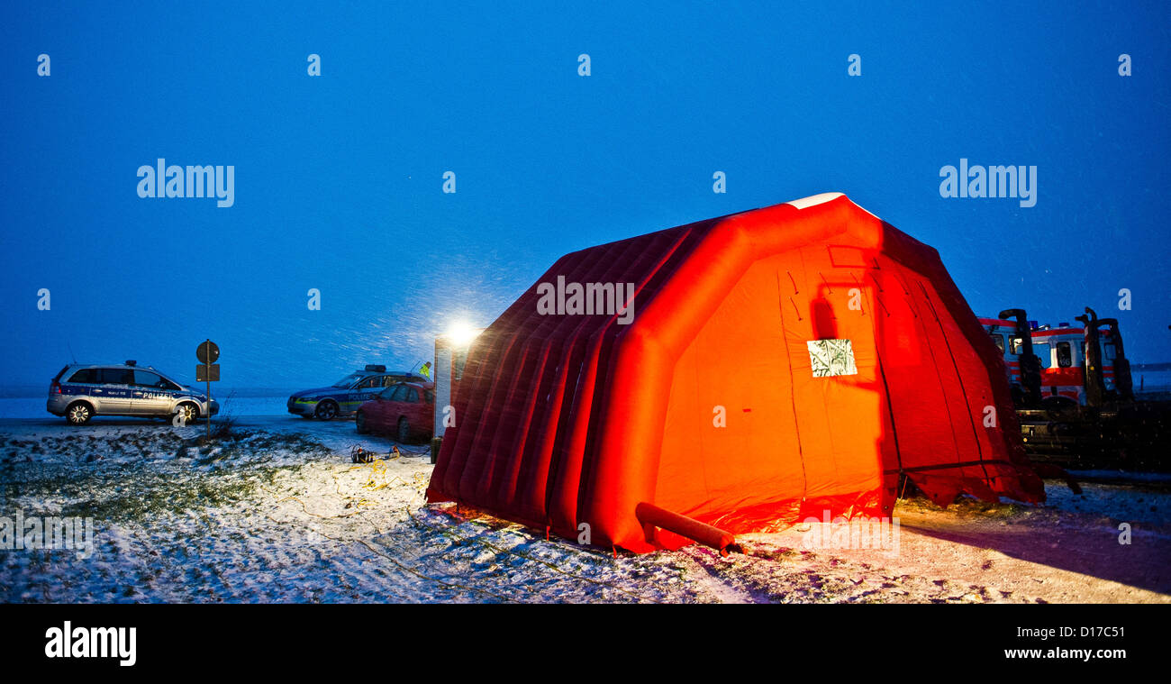 The mobile rescue operations center and an inflatable tent stand on a field in Woelfersheim, Germany, 8 December 2012. An ultralight airplane and a light aircraft had crashed during the night leaving at least seven people dead, whose bodies were recovered from the wreckage. Photo: Nicolas Armer Stock Photo