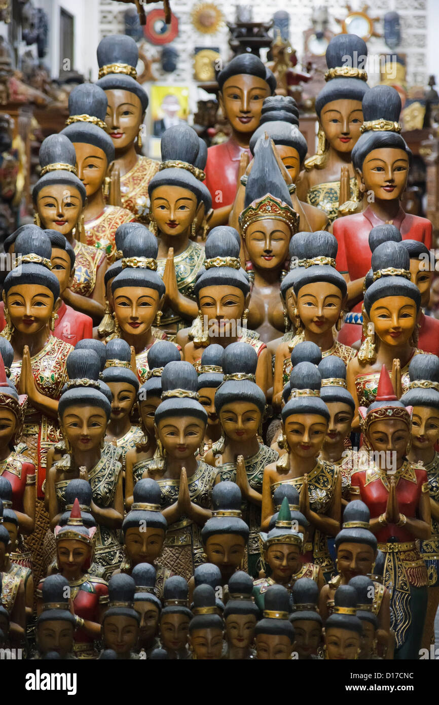 Thailand, Chiang Mai, wood carved religious statues for sale in a store