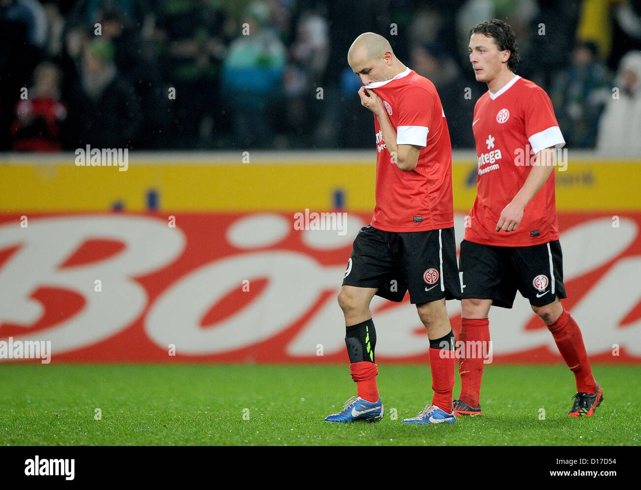 Mainz's Elkin Soto (L) Julian Baumgartlinger leave pitch after German Bundesliga match between Borussia Moenchengladbach FSV Mainz 05 Borussia-Park in Moenchengladbach Germany 09 December 2012 Photo: JONAS GUETTLER (ATTENTION: EMBARGO CONDITIONS! DFL permits further utilisation up 15 pictures only (no sequntial pictures or video-similar series pictures allowed) via internet online media during match (including halftime) taken inside stadium and/or prior start match DFL permits unrestricted transmission digitised recordings during match exclusively internal editorial processing only (e.g via Stock Photo