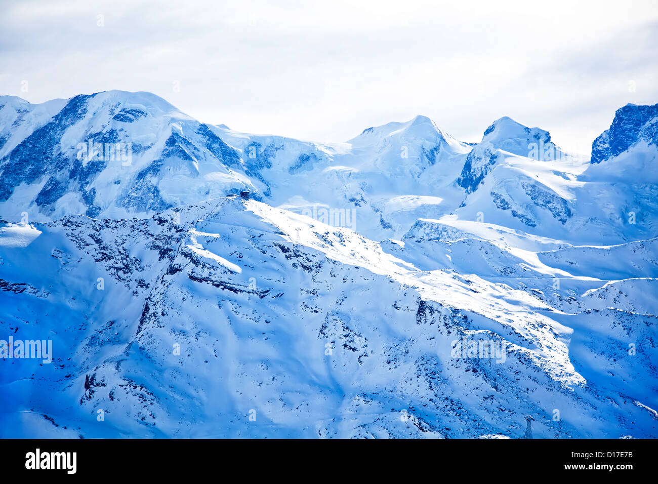 Swiss alps landscape with blue snow Stock Photo