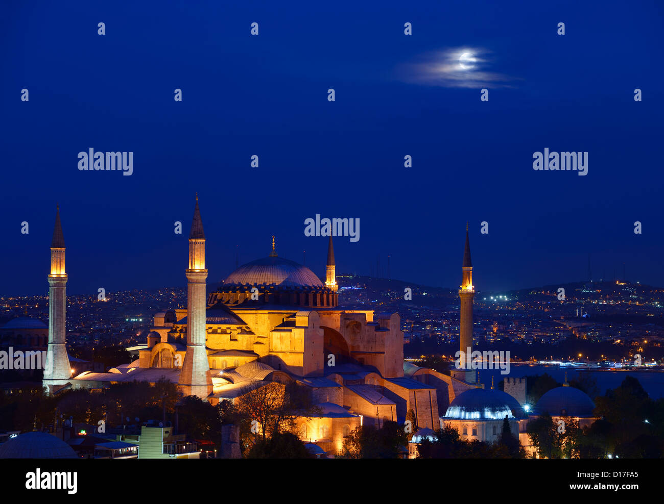 Night lights on Hagia Sophia under a full moon at twilight in Istanbul ...