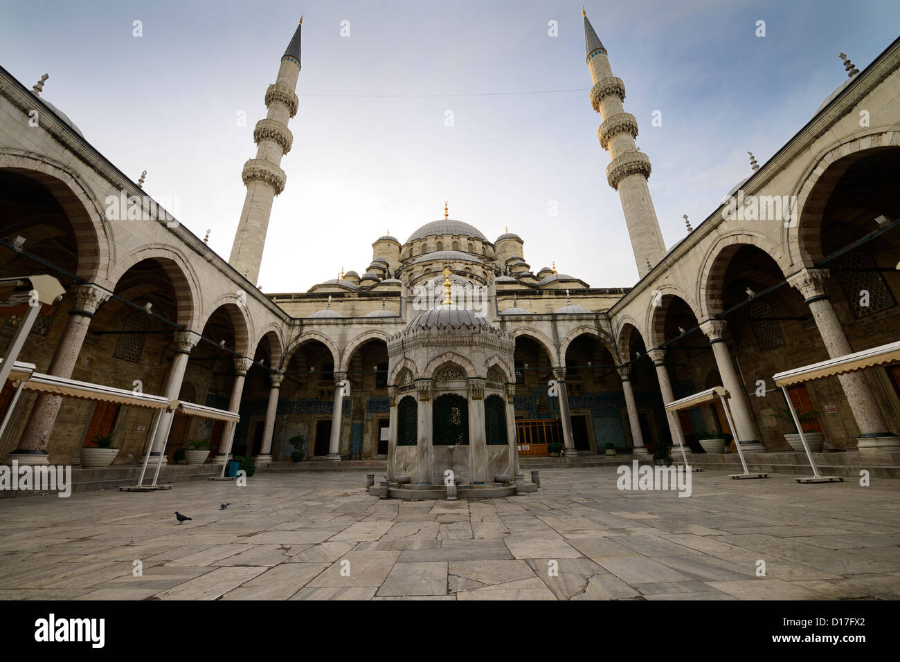 Monumental courtyard with two minarets and ablution fountain at the New Mosque Istanbul Stock Photo