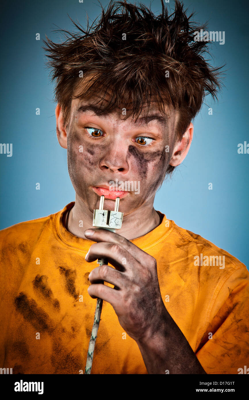 Boy has a electric shock Stock Photo Alamy