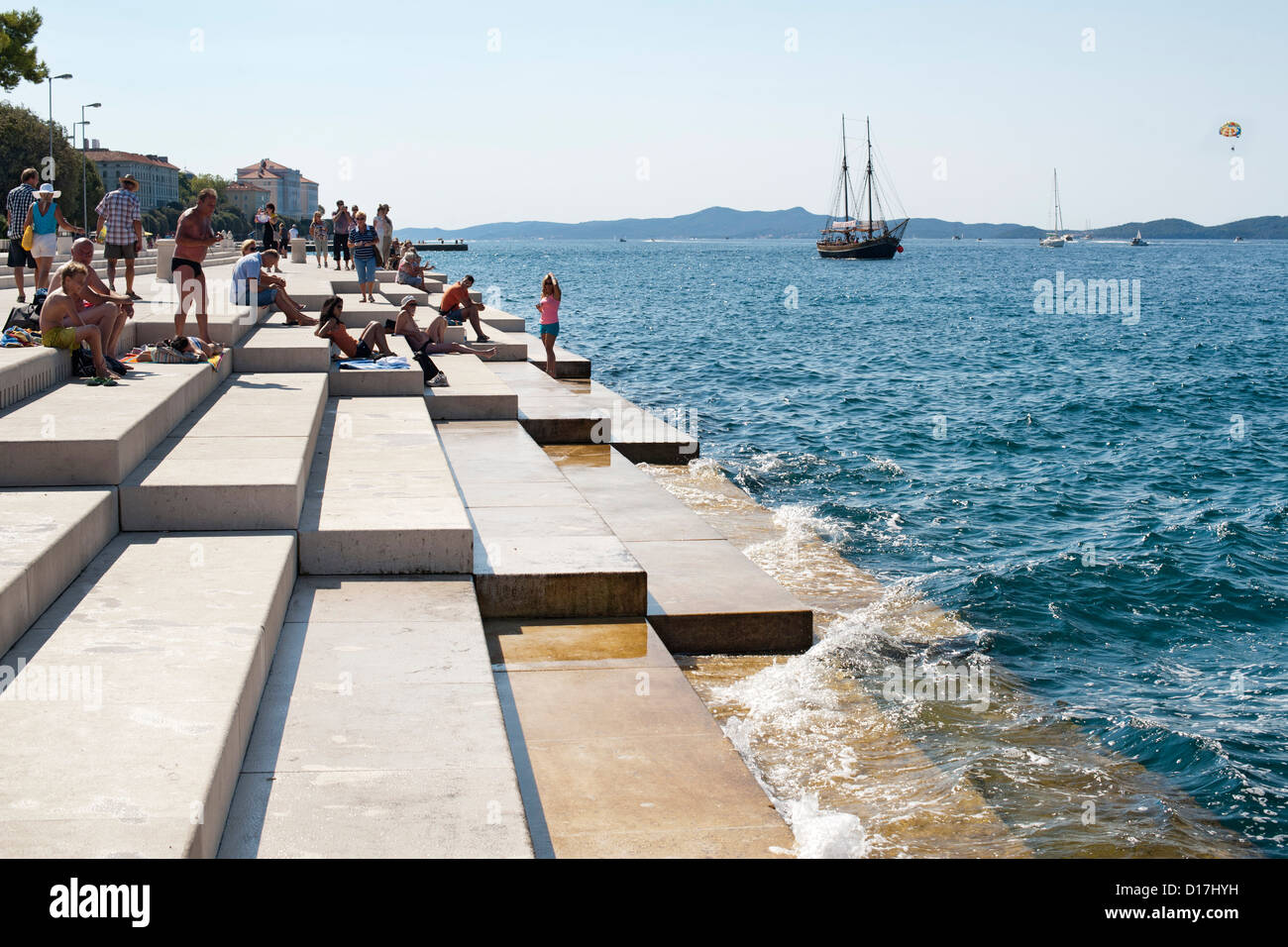 People on the steps of the 'Sea Organ' in Zadar on the Adriatic coast of Croatia. Stock Photo