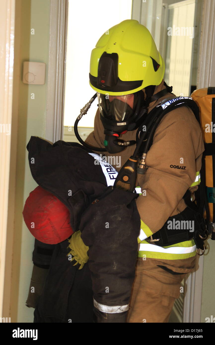 Fire crews put their rescue skills to the test on Monday (10 December) when they took part in a training exercise at one of GravesendÕs tallest buildings.  Firefighters were given the scenario that a resident in a ninth floor flat had been cooking some festive nibbles in preparation for the big day but had been distracted, leaving the food to go up in flames. Fire crews put their rescue skills to the test on Monday (10 December) when they took part in a training exercise at one of GravesendÕs tallest buildings.  Firefighters were given the scenario that a resident in a ninth floor flat had bee Stock Photo