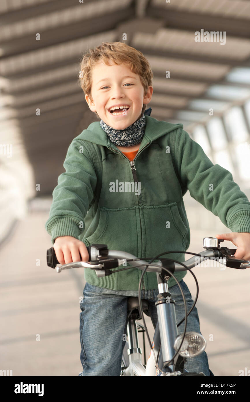 Blond youngster with bicycle hires stock photography and images Alamy